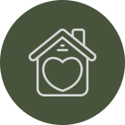House with a heart in the center, surrounded by a green circle
